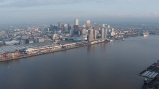 PVED01_022 - 4K aerial stock footage of wide orbit of Downtown New Orleans at sunrise, Louisiana