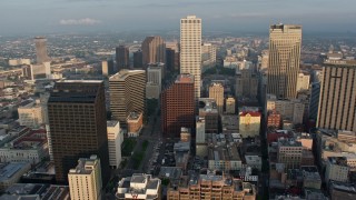 PVED01_024E - 4K aerial stock footage of Downtown New Orleans and City Hall, approach the Superdome at sunrise, Louisiana