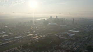 PVED01_026 - 4K aerial stock footage approach Superdome and Downtown New Orleans from Mid-City at sunrise, Louisiana