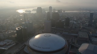 PVED01_027 - 4K aerial stock footage tilt to reveal and the Superdome in Downtown New Orleans at sunrise, Louisiana