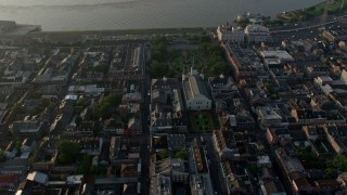 PVED01_033E - 4K aerial stock footage of St. Louis Cathedral and Jackson Square, French Quarter, reveal Downtown New Orleans, Louisiana, sunrise