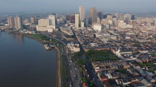 PVED01_034 - 4K aerial stock footage of St. Louis Cathedral and Downtown New Orleans at sunrise, Louisiana