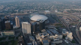 PVED01_041 - 4K aerial stock footage orbiting the Superdome in Downtown New Orleans, Louisiana at sunrise