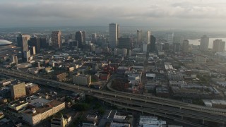 PVED01_048E - 4K aerial stock footage fly over Downtown New Orleans to the French Quarter in Louisiana at sunrise
