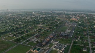 PVED01_062 - 4K aerial stock footage orbit urban residential neighborhoods in the Lower Ninth Ward of New Orleans at sunrise, Louisiana