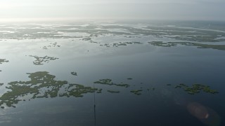 PVED01_068E - 4K aerial stock footage fly over marshland and bayou at sunrise in St. Bernard Parish, Louisiana