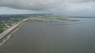 PVED01_090 - 4K aerial stock footage wide orbit of a marina on Lake Pontchartrain at sunrise in Louisiana