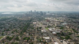 PVED01_109 - 4K aerial stock footage wide orbit of Mid-City streets to the Downtown skyline of New Orleans, Louisiana