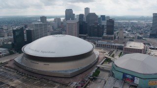 PVED01_111 - 4K aerial stock footage tilt from freeway interchange to reveal Superdome and Downtown New Orleans, Louisiana