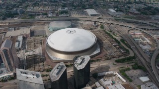 PVED01_122 - 4K aerial stock footage orbiting the Louisiana Superdome in Downtown New Orleans, Louisiana