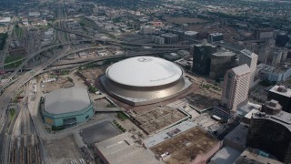 PVED01_124 - 4K aerial stock footage slow orbit of the Superdome and New Orleans Arena in Downtown New Orleans, Louisiana