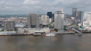 PVED01_131 - 4K aerial stock footage flyby Downtown New Orleans to reveal Cruise Ship at port and the Crescent City Connection, Louisiana
