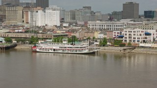 PVED01_135 - 4K aerial stock footage of Steamboat Natchez on the French Quarter riverfront in New Orleans, Louisiana