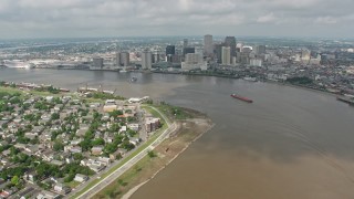 PVED01_143E - 4K aerial stock footage fly over Mississippi River and skyscrapers in Downtown New Orleans to reveal Superdome, Louisiana