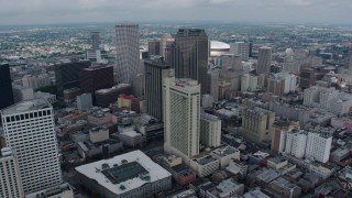 PVED01_144 - 4K aerial stock footage fly over hotels and skyscrapers in Downtown New Orleans to reveal Superdome, Louisiana