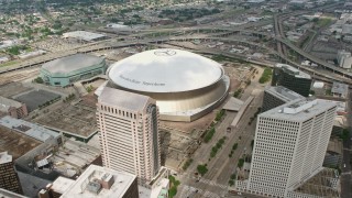 PVED01_145 - 4K aerial stock footage approach and fly over Superdome and freeway interchange in Downtown New Orleans, Louisiana