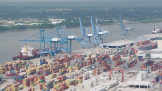 PVED01_147 - 4K aerial stock footage orbit cranes and rows of containers at the Port of New Orleans, Louisiana