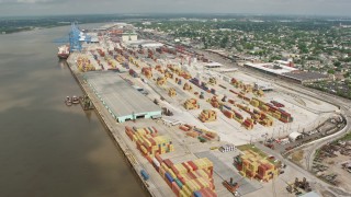 PVED01_148E - 4K aerial stock footage orbit cargo cranes at the Port of New Orleans in Louisiana