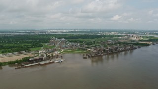 PVED01_152 - 4K aerial stock footage orbit a riverfront factory in New Orleans, Louisiana