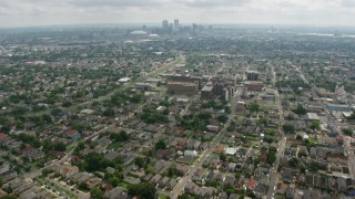 PVED01_154 - 4K aerial stock footage tilt from Uptown suburbs to reveal Downtown New Orleans skyline, Louisiana
