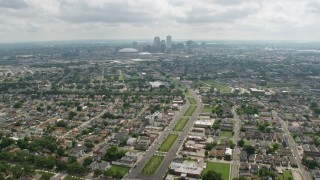 PVED01_155 - 4K aerial stock footage tilt from Garden District suburbs to reveal Downtown New Orleans skyline, Louisiana