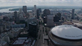 PVED01_158 - 4K aerial stock footage orbit Downtown New Orleans skyscrapers and the Superdome, Louisiana