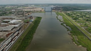 PVED01_164 - 4K aerial stock footage fly over Industrial Canal toward Florida Avenue Bridge in New Orleans, Louisiana