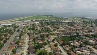 PVED01_169E - 4K aerial stock footage approach New Orleans Lakefront Airport in Louisiana