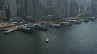 SS01_0014 - 5K stock footage aerial video flyby piers and tilt to skyscrapers on Hong Kong Island, China
