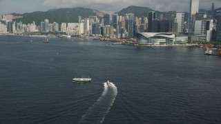 SS01_0015 - 5K stock footage aerial video of Hong Kong Island shoreline seen from Victoria Harbor in Hong Kong, China