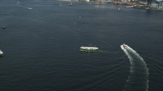 SS01_0016 - 5K stock footage aerial video approach and tilt to two ferries sailing Victoria Harbor in Hong Kong, China