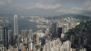 SS01_0037 - 5K stock footage aerial video fly over high-rises to approach skyscrapers on the shore of Hong Kong Island, China
