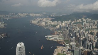 SS01_0044 - 5K stock footage aerial video of Victoria Harbor and waterfront convention center on Hong Kong Island, China