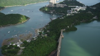 SS01_0059 - 5K stock footage aerial video fly over reservoir and tilt to reveal apartment buildings overlooking harbor on Hong Kong Island, China
