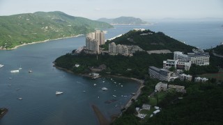 SS01_0066 - 5K stock footage aerial video approach apartment complexes by Tai Tam Harbor on Hong Kong Island, China