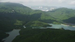 SS01_0074 - 5K stock footage aerial video of Tai Tam Reservoir and green hills on Hong Kong Island, China