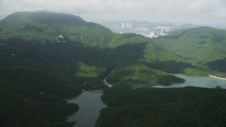SS01_0075 - 5K stock footage aerial video of Tai Tam Reservoir and green mountain peak on Hong Kong Island, China