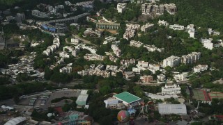 SS01_0077 - 5K stock footage aerial video of hillside apartment buildings and Ocean Park on Hong Kong Island, China