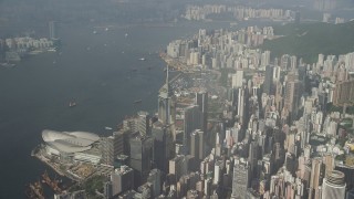 SS01_0084 - 5K stock footage aerial video pan across harbor and convention center in Hong Kong, China