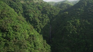 SS01_0108 - 5K stock footage aerial video approach a waterfall in the mountains with forest on Hong Kong Island, China