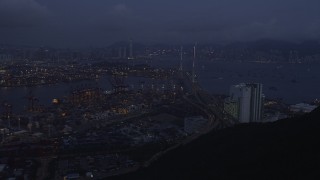 SS01_0112 - 5K stock footage aerial video approach the Port of Hong Kong and the Stonecutters Bridge at night, China