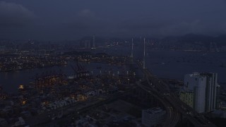 SS01_0113 - 5K stock footage aerial video fly over the Port of Hong Kong to approach Stonecutters Bridge at night, China