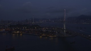 SS01_0117 - 5K stock footage aerial video approach Port of Hong Kong at end of the Stonecutters Bridge at night in China