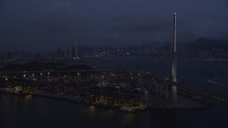 SS01_0118 - 5K stock footage aerial video approach the shore of the Port of Hong Kong at night, China