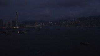 SS01_0123 - 5K stock footage aerial video of skylines of Kowloon and Hong Kong Island at night, China