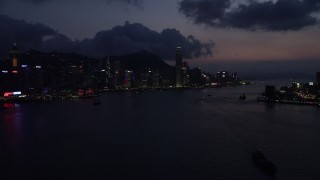 SS01_0140 - 5K stock footage aerial video of approaching Hong Kong Island and Victoria Harbor at nighttime, China