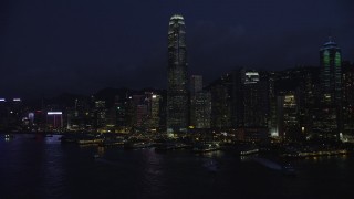SS01_0147 - 5K stock footage aerial video approach International Finance Centre and piers on Hong Kong Island at night, China