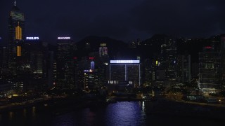 SS01_0152 - 5K stock footage aerial video flyby Central Plaza and high-rises on Hong Kong Island at night, China