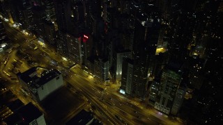 SS01_0167 - 5K stock footage aerial video bird's eye view of busy street and office buildings at night on Hong Kong Island, China