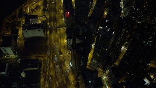 SS01_0168 - 5K stock footage aerial video bird's eye view of a busy street and office towers at night in Hong Kong Island, China
